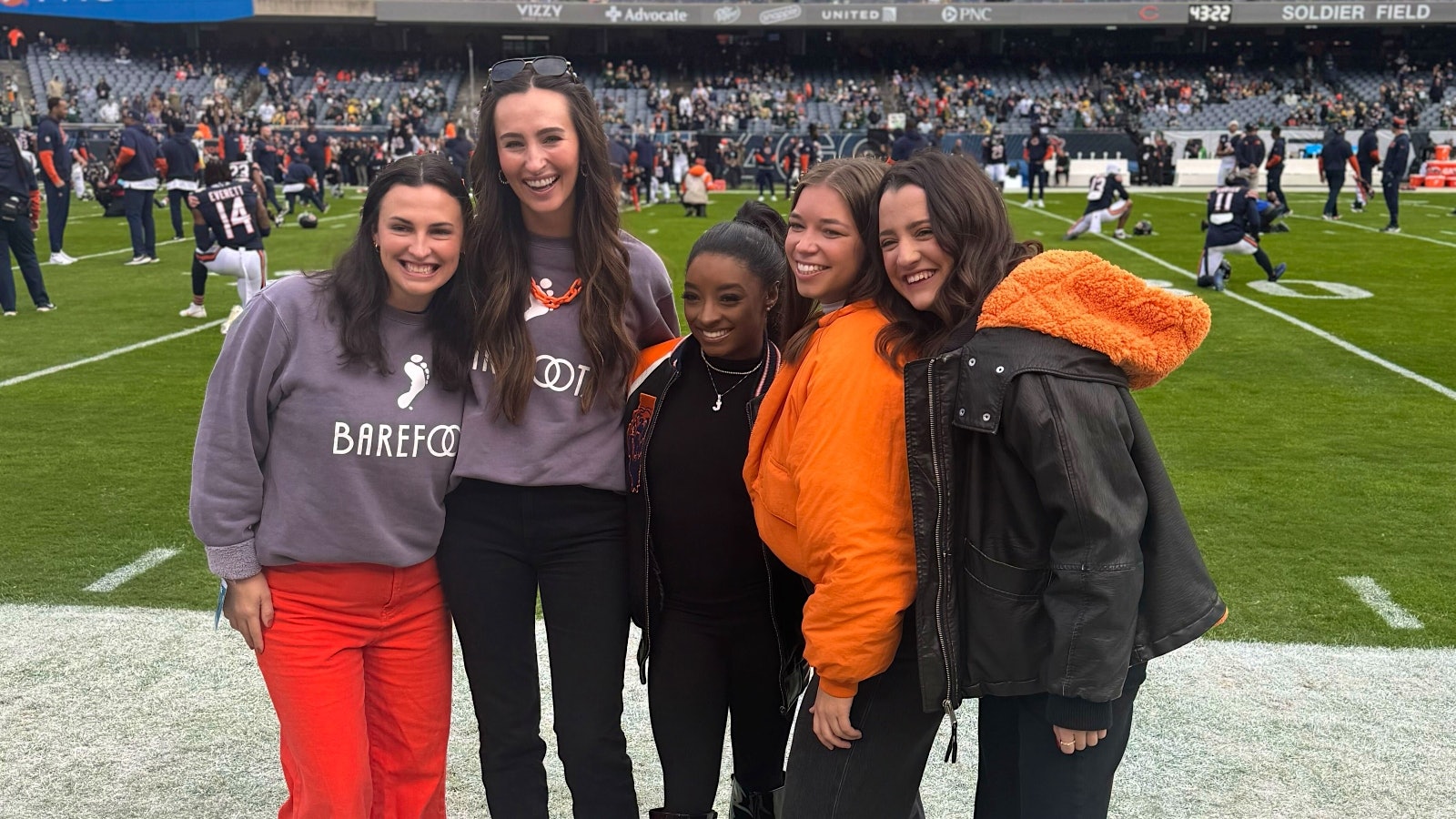 Simone Biles with contest winner Anna Duggins (second from right) and guests at Soldier Field in Chicago